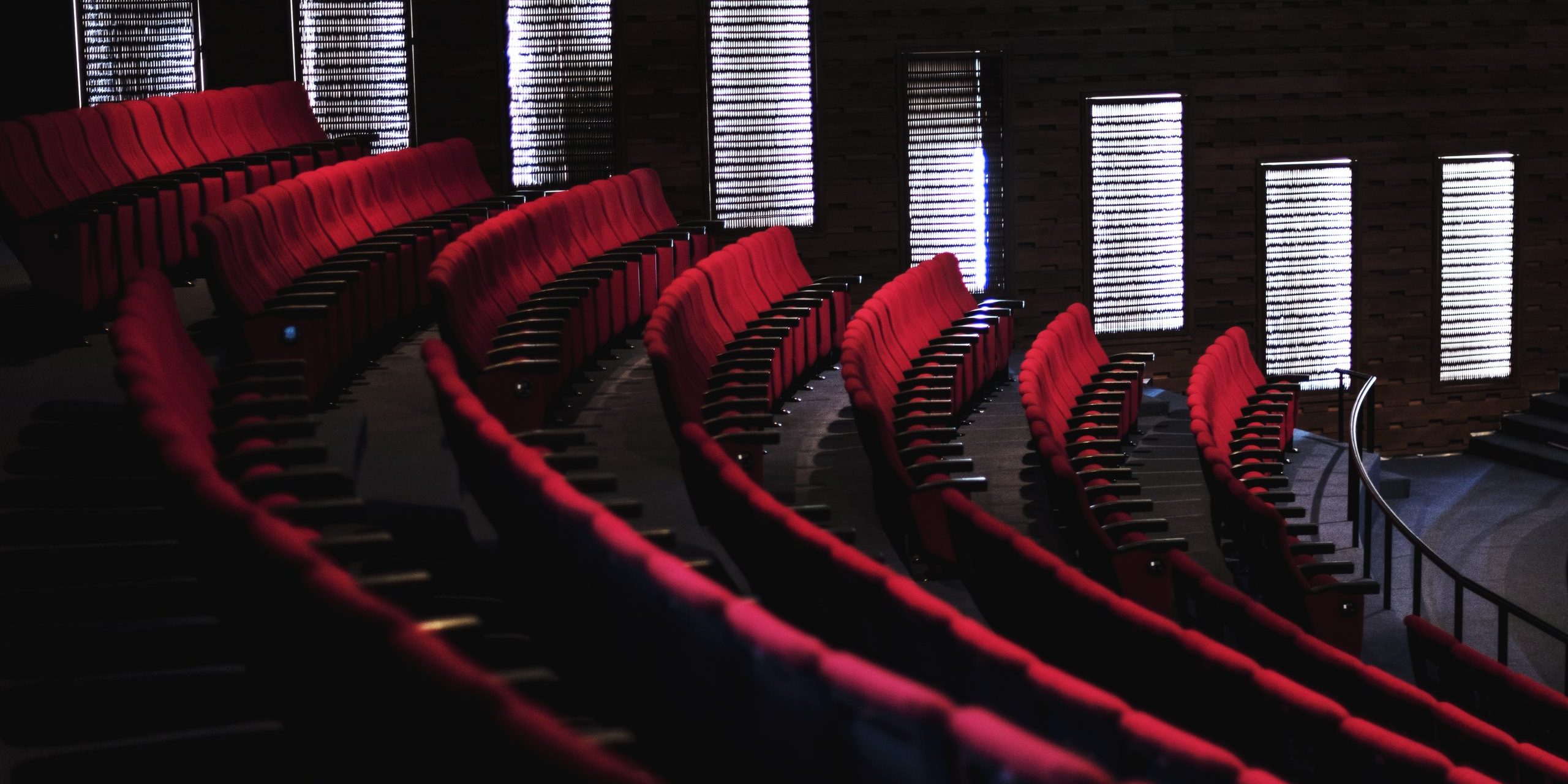 Rows of red seats in a theater